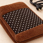 Close-up of soft velvet cover of electric hot water bag
